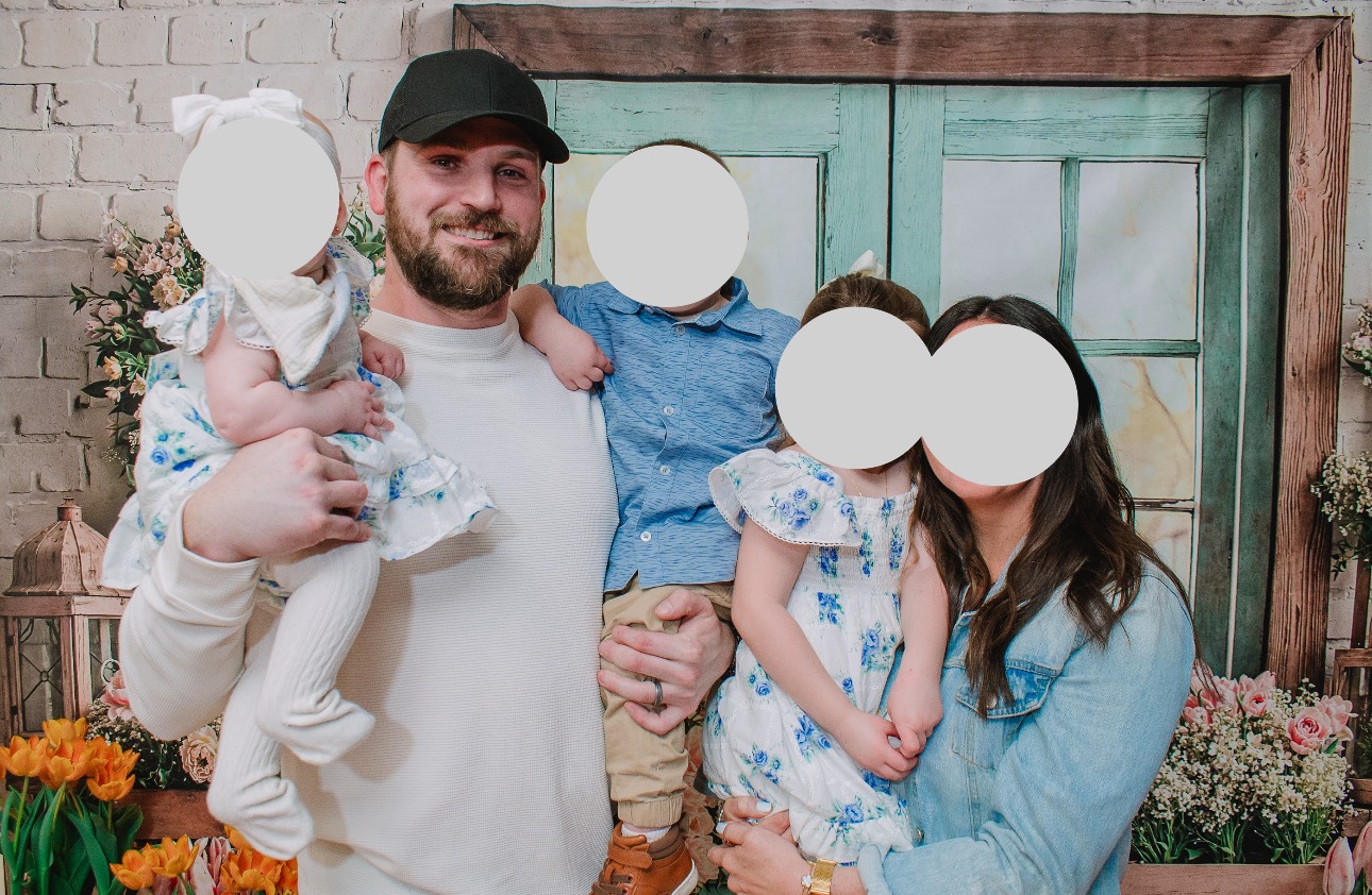 Alex with his wife and three young children